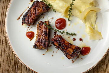 delicious fried ribs in sauce
