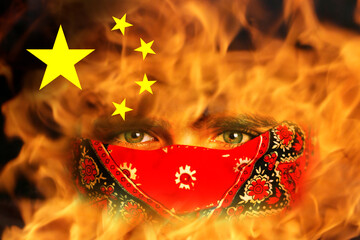 Protests China. Chinese real estate and debt crisis. Zero covid and lockdown protest in China. Young man in bandana. Revolution demonstration. Fire, flame. Communism