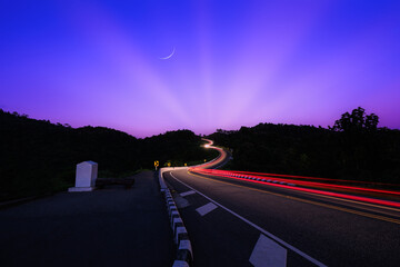 long exposure shot  car light twilight time blue and pink sky background, at Curved Road No.3 or...