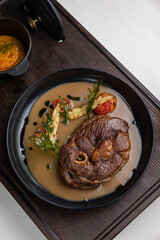 delicious fried steak in sauce in a restaurant
