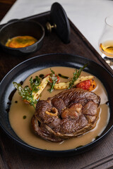 delicious fried steak in sauce in a restaurant
