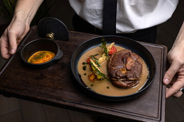 delicious fried steak in sauce in a restaurant
