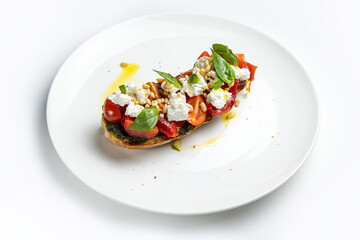 delicious bruschetta with cheese, meat, vegetables in a restaurant
