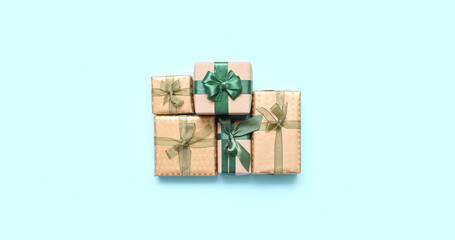 Beautiful Christmas presents on light blue background, top view