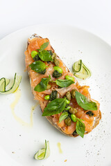 delicious bruschetta with cheese, meat, vegetables in a restaurant
