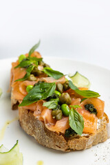 delicious bruschetta with cheese, meat, vegetables in a restaurant
