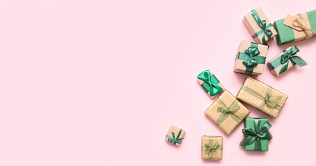 Gift boxes on pink background with space for text