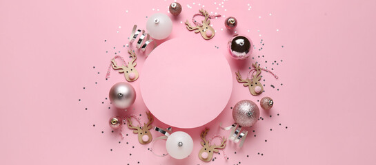 Composition with blank card and Christmas decorations on pink background
