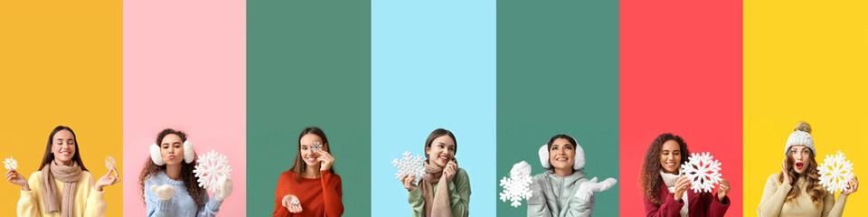 Group of young women in winter clothes and with snowflakes on color background