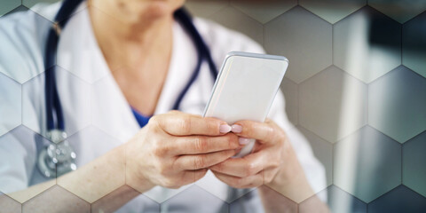 Female doctor using her mobile phone, geometric pattern