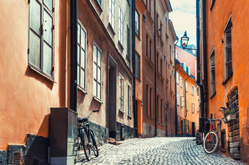 Street with old colorful buildings in Old Town district in Stockholm, Sweden