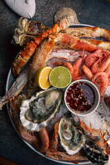 Assorted seafood with sauce and lemon