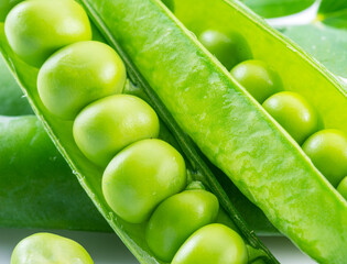 Perfect green peas in pea pods close up. Food background.