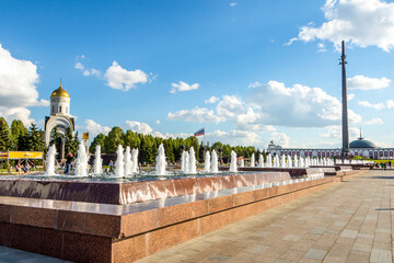 Moscow, Russia - june 2022: Fountain (pillars of water) against the backdrop of the Victory Monument. Victory Park on Poklonnaya Gora (Poklonnaya Gora)