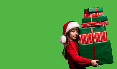 A cute girl in a Santa hat holds a lot of gifts for Christmas and New Year 2023. Sale and Black Friday. Free space for the inscription