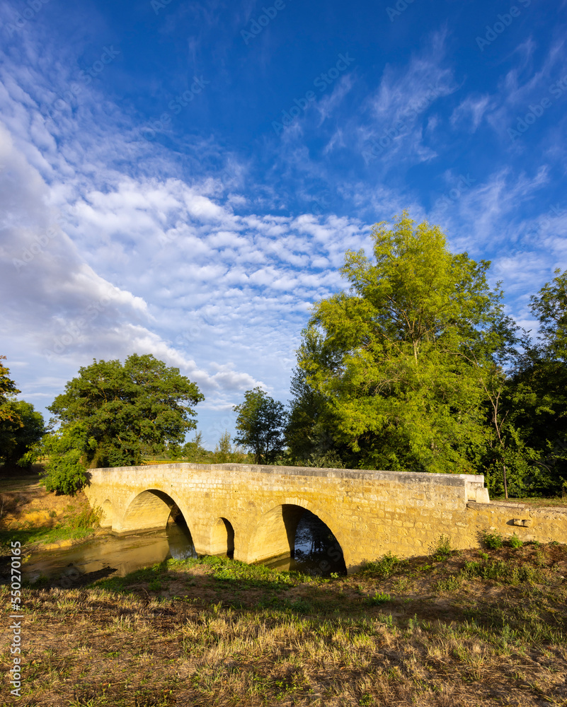 Poster romanesque bridge of artigue and river osse near larressingle on route to santiago de compostela, un