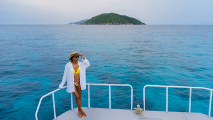 Asian Thai women on a boat trip at a catamaran near the Similan Islands Thailand Phangnga