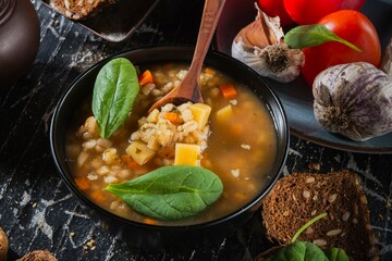 Homemade soup- dark photo. Background food- still life nosh. Serving meals in the home kitchen. Cook meals for the family