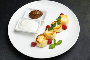 delicious cheesecakes with sour cream in a restaurant
