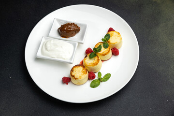 delicious cheesecakes with sour cream in a restaurant
