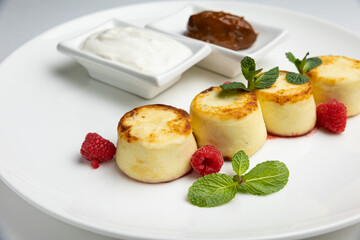 delicious cheesecakes with sour cream in a restaurant
