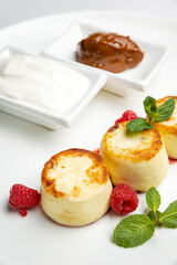 delicious cheesecakes with sour cream in a restaurant
