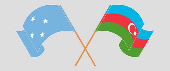 Crossed and waving flags of Micronesia and Azerbaijan