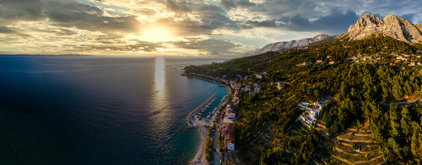 Romantic morning seascape of Adriatic sea. Colorful summer view of small beach in famous resort -...