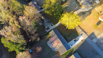 Top view low dense single family homes on large lot size in woodland area lush green tree fall foliage near Atlanta, Georgia, USA