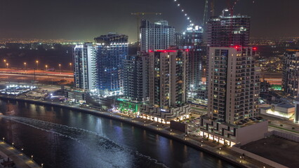 Towers at the Business Bay aerial night timelapse in Dubai, United Arab Emirates