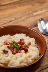 Slovakian halusky served with sheep cheese and roasted bacon