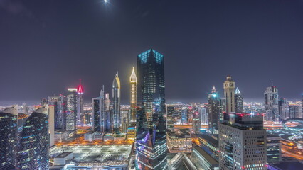 Fototapeta na wymiar Panorama of futuristic skyscrapers in financial district business center in Dubai all night timelapse