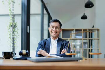 Portrait of a Asian man lawyer studying a lawsuit for a client before going to court