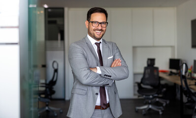 Portrait of young successful ceo businessman smiling in corporate office - obrazy, fototapety, plakaty
