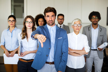 Fototapeta premium Group of unsuccessful business people and badly managed company leads to unhappiness