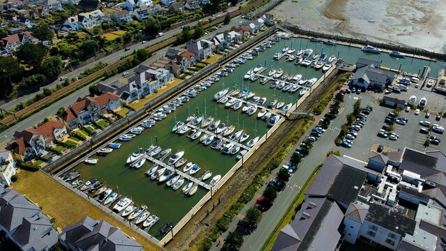 Aerial view of Deganwy Marina port with boats surrounded by buildings