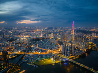 Top view aerial photo from flying drone of a Ho Chi Minh City with development buildings, transportation, energy power infrastructure. Financial and business centers in developed Vietnam.