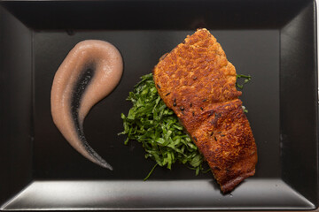 Close up on a pork steak served for dinner in a gourmet restaurant.