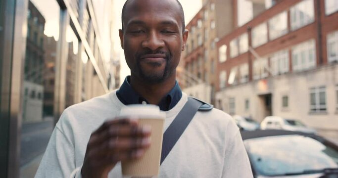 Businessman walking and phone news with coffee in city of New York, USA on morning commute. 5g, social network or email update with happy black man drinking takeaway latte on walk to work.