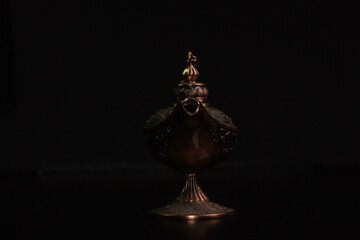 Aladdin's magic lamp isolated on black background