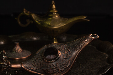 Aladdin's magic lamp isolated on black background