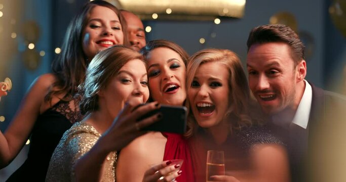 Selfie, phone and friends celebrate party for birthday, new years eve event or fun together. Smartphone photography, happiness and diverse friendship or comic celebration and laugh with champagne