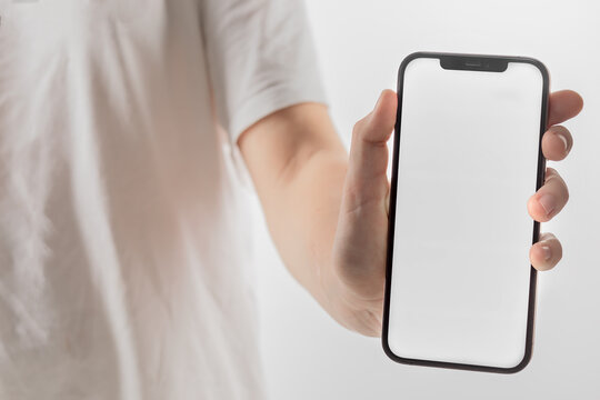 Hand holding Smartphone iPhone and isolated on white background for your mobile phone app or web site design, logo Global Business technology - include clipping path. (Businessman hand iPhone)