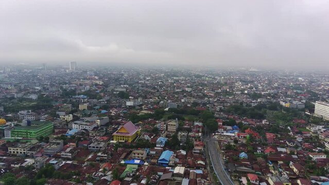 February 5, 2022. Above Pekanbaru, Riau, Indonesia. Leighton Bridge or Siak Bridge above the Siak River. Aerial footage.