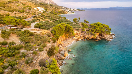 Beautiful azure blue Mediterranean beach surrounded by green trees in Croatia