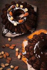 Chocolate Christmas cake with nuts and chocolate glaze, top view