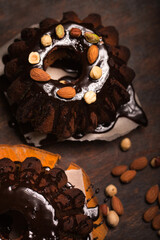 Chocolate Christmas cupcake with nuts and chocolate glaze, top view