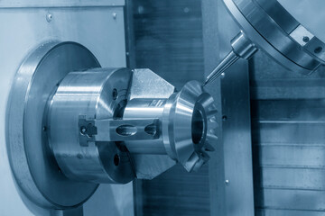 The 5-axis CNC milling machine  cutting the metal gear part.