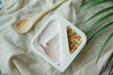 strawberry yogurt and granola Musli in a plastic container 