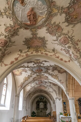 Lovely view of the side aisle with the elaborately designed rococo stucco ceilings from 1746 in the...